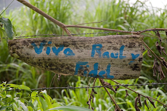 Viva Raul y Fidel, painted on a banana leaf, on the side of the road.